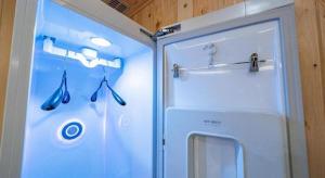 a refrigerator with three pairs of umbrellas in it at Luxury Motel Daejeon in Daejeon +132 photos