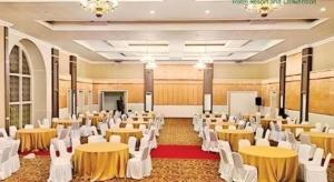 a banquet hall with tables and chairs in a room at AZHIMA Resort and Convention in Solo +143 photos