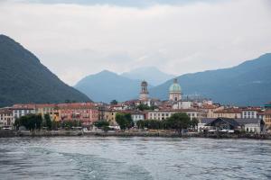 a view of a city from a body of water at La piccola Lami in Intra