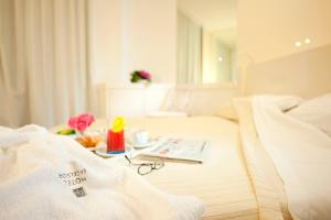 Postel nebo postele na pokoji v ubytování Hotel Excelsior