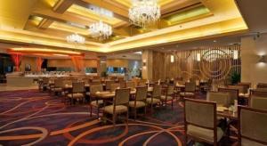 a conference room with tables and chairs and chandeliers at Putian Haiyuan International Hotel in Putian +228 photos