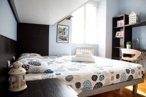 A bed or beds in a room at Chat&Chill Vatican Apartment