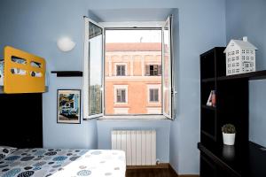 A bed or beds in a room at Chat&Chill Vatican Apartment