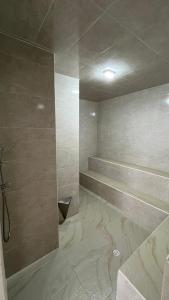 a bathroom with a walk in shower and a sink at Tu mejor opción por san gil in San Gil