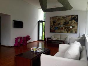 a living room with a couch and a table at VillaTel Salse in Bandung