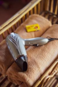 a hair dryer sitting on top of a wooden crib at Sunsetview Safari Lodge in Bardiyā