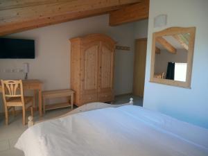 Posteľ alebo postele v izbe v ubytovaní Hotel Elbele Garnì