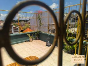 a view of a patio from a balcony at Golden Cage Boutique Hostel in Denpasar