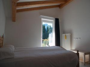 Posteľ alebo postele v izbe v ubytovaní Hotel Elbele Garnì