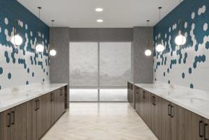 a bathroom with two sinks and a large window at La Quinta Inn & Suites by Wyndham Jackson in Jackson