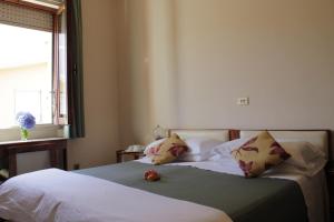 Postel nebo postele na pokoji v ubytování Hotel MariaLetizia