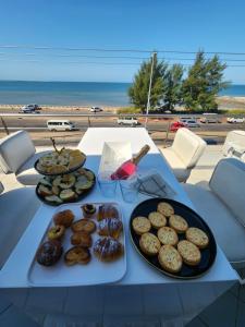 a table with a bunch of donuts on it at Premium Suites in Maputo