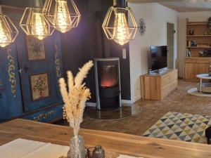 a living room with a wood stove in a room at Beim FörschtnSchorsch in Königsfeld +29 photos