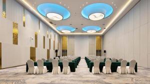 a conference room with chairs and lights on the ceiling at Taiyi International Hotel in Wenzhou +223 photos