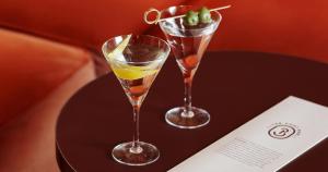 two champagne glasses sitting on a table at Clarion Hotel Post in Gothenburg