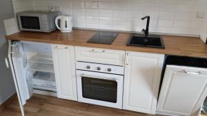 Köök või kööginurk majutusasutuses Willa Wisełka