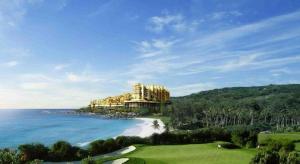 a view of a resort on a beach next to the ocean at The Century Seaview Hotel in O-kung