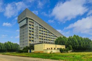 a large building with a pointed roof on top of it at Beijing Qiaobo International Conference Hotel in Beijing