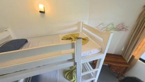 a couple of bunk beds in a room at Asanka Surf Hostel & food in Midigama +39 photos