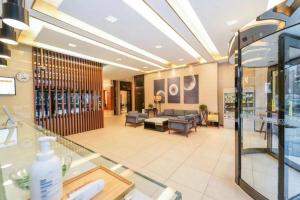 a lobby of a hospital with a waiting room at Jinjiang Inn Select Shanghai International Tourism and Resorts Zone Chuansha Road Subway Station in Shanghai