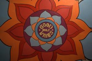 a stained glass flower with the words god only mercy at Kashi Vibes Hostel in Varanasi