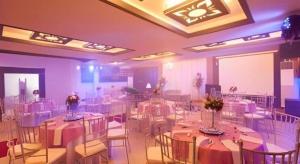 a banquet hall with tables and chairs in a room at L Square Hotel in Tarlac +125 photos