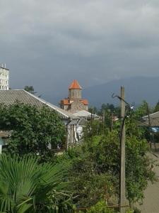 a building with a clock tower in a city at Welcome to Kobuleti in K'obulet'i