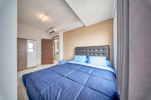 Ένα ή περισσότερα κρεβάτια σε δωμάτιο στο Mekarwangi Square by Eazystay +20 φωτογραφίες