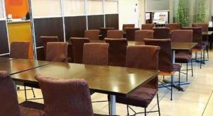 a row of tables and chairs in a room at AI HOTEL OYAMA in Sano