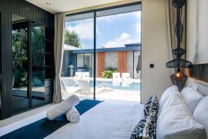 Postel nebo postele na pokoji v ubytování Villa Elkara Umalas