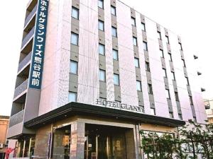 a building with a sign on the front of it at E Hotel Kumagaya Annex in Kumagaya