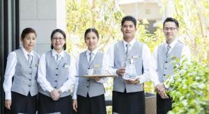 a group of people standing next to each other at Goto Tsubaki Hotel in Hukue