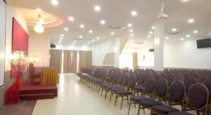 a room with a bunch of chairs and a table at Lipis Plaza Hotel in Kuala Lipis