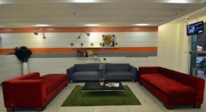 a living room with two couches and a tv at First Residence Hotel Kemaman in Cukai +57 photos