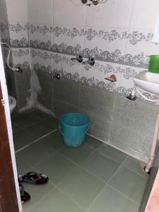 a bathroom with a tub next to a sink at Krishna home stay in Tārna