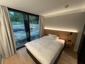 Postel nebo postele na pokoji v ubytování Hotel 1802