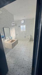 a bathroom with a sink and a toilet at شالية برفيزا اليونانية دورين in Taif +10 photos