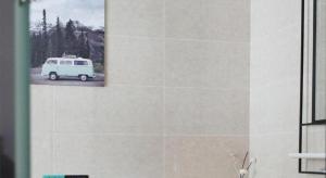 a picture of a van parked on a wall at Xana Hotelle·Heze Railyway Station in Heze