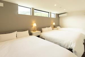 Voodi või voodid majutusasutuse 海沿いの1日1組限定の貸切別荘 Smile Itoshima Stay toas