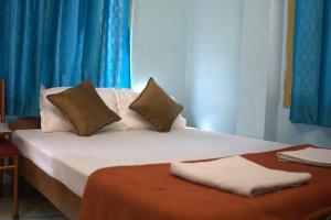 Postel nebo postele na pokoji v ubytování Kashi Vibes Hostel