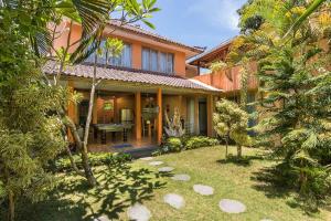 a house with a garden in front of it at Villa Odil, Great Value 700m beach & 15m pool in Seminyak