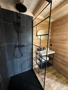 a bathroom with a shower and a sink at Lodge with private spa in Geishouse +9 photos
