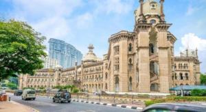 a large building with a clock tower on top of it at OYO 175 Lotus Hotel in Kuala Lumpur