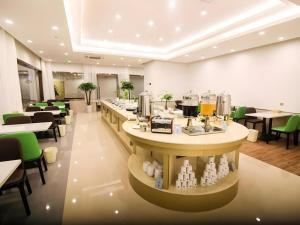 Nápoje v ubytování GreenTree Inn Huaibei Xiangshan District Guogou Square Hotel