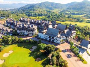 an aerial view of a mansion with a golf course at Angsana Xishuangbanna in Jinghong