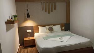 a bedroom with a bed with a tray on it at Wild root stay- Aster Chalet in Wayanad +57 photos