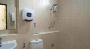a bathroom with a shower and a toilet and a sink at Phanthipha Residence in Khon Kaen +53 photos