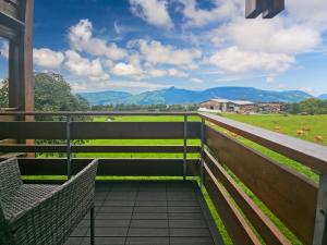 a view from the balcony of a farm house with mountains at Hotel Aeschi Interlaken - Handwritten Collection in Aeschi
