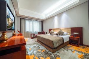 Postel nebo postele na pokoji v ubytování Hangzhou Haiwaihai Hotel + 31 fotografií