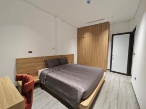 Postel nebo postele na pokoji v ubytování Minerva Aparthotel Hanoi